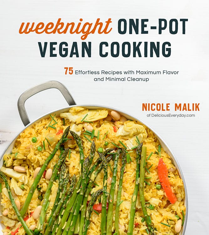 Cookbook cover with a skillet photo from above full of yellow rice, asparagus, peas, white beans. There is a text overlay saying weeknight one-pot vegan cooking by Nicole Malik deliciouseveryday.com