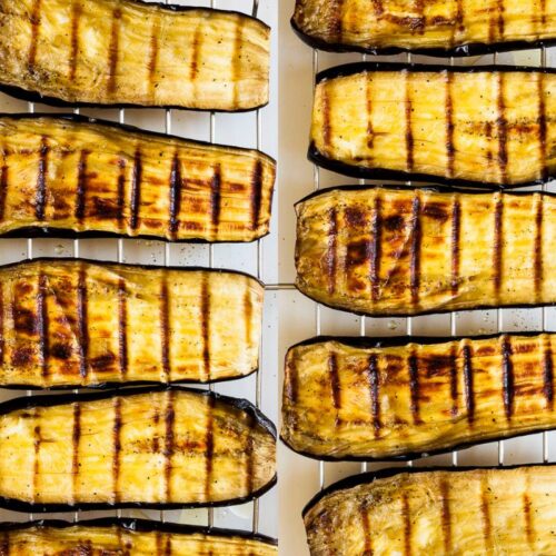 Roasted eggplant slices on a grill rack