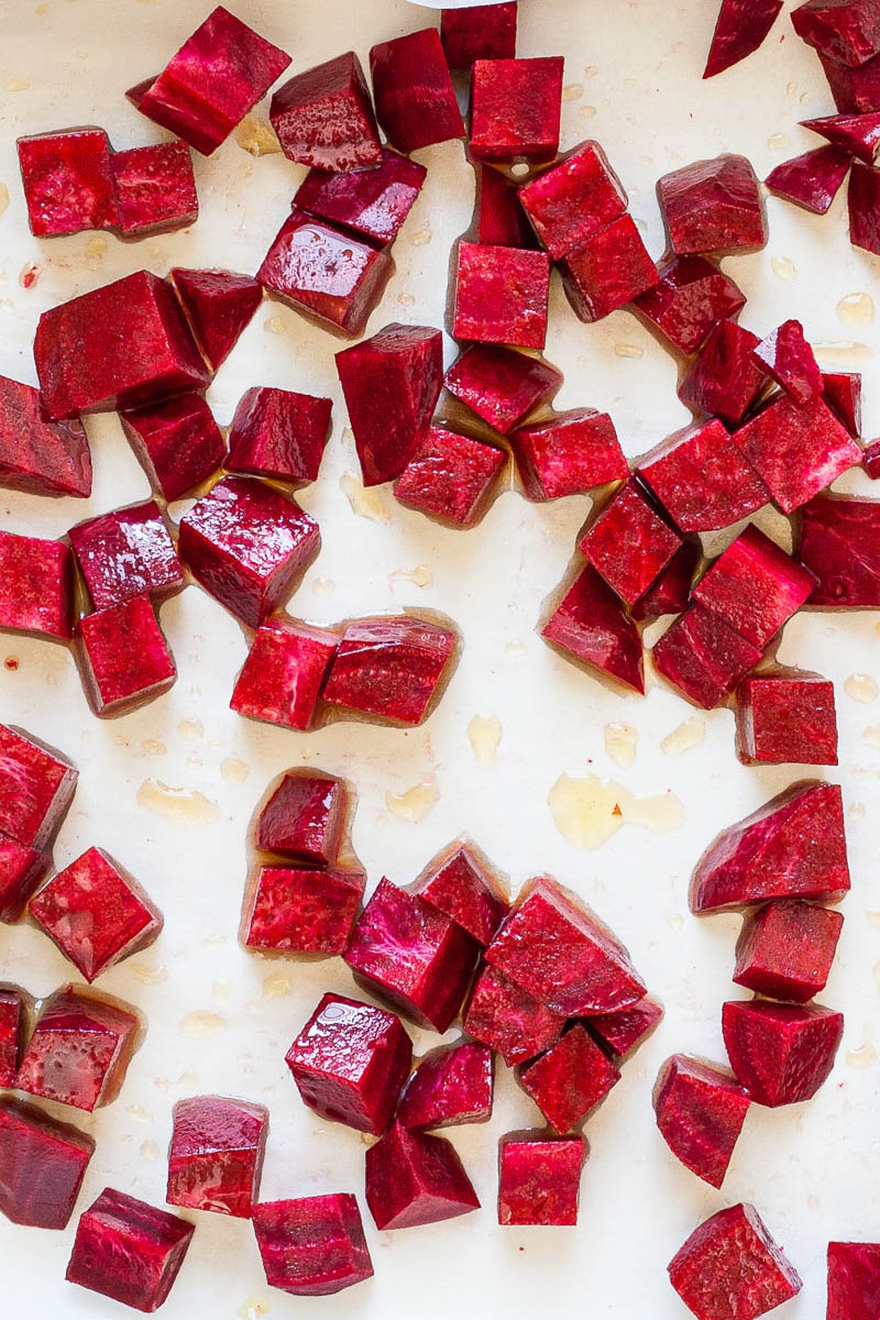 Diced purple beetroot on a white parchment paper