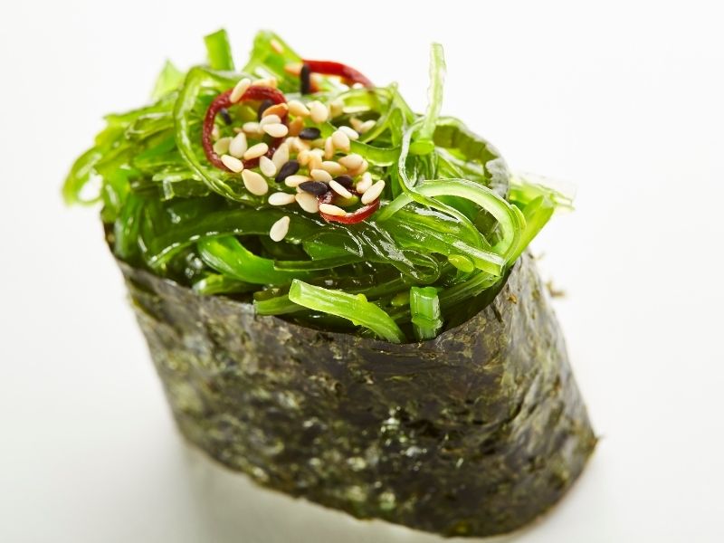 Green seaweed strips are rolled in nori sheets