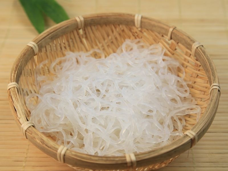White opaque noodles in a woven basket