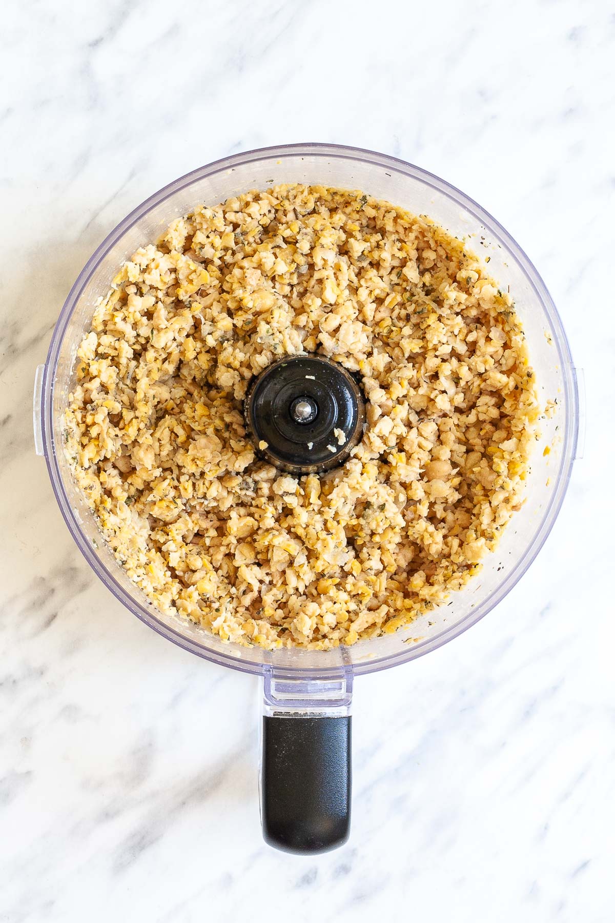 Food processor with light brown crumbles
