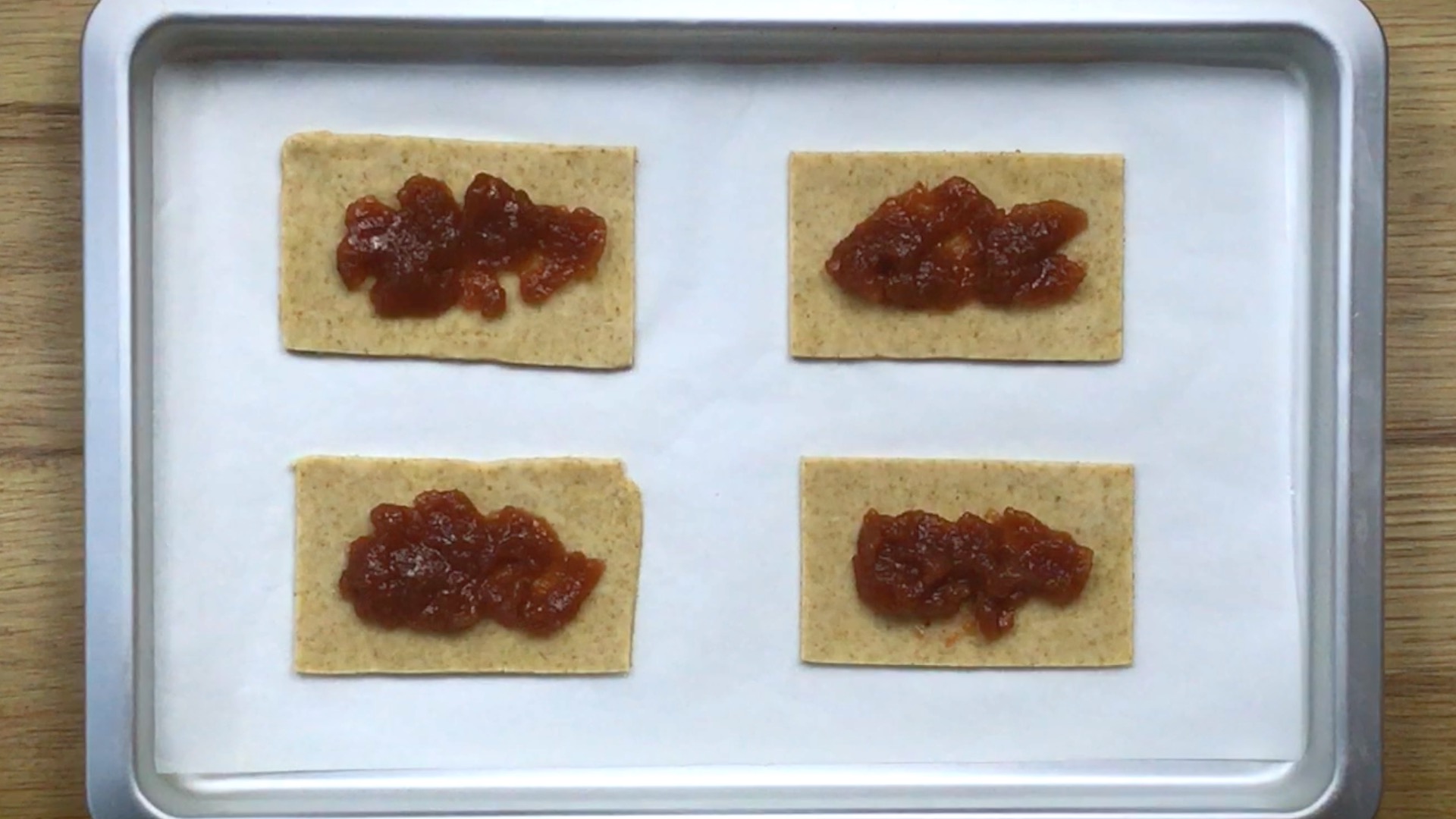 4 rectangular pie dough with a bit of jam in the middle. 