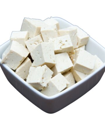 Small dark gray and white bowl with tofu cubes