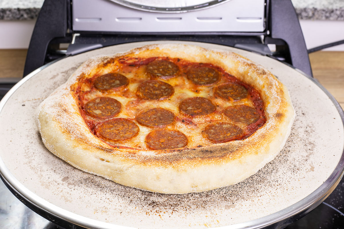 Pepperoni pizza in a pizza oven