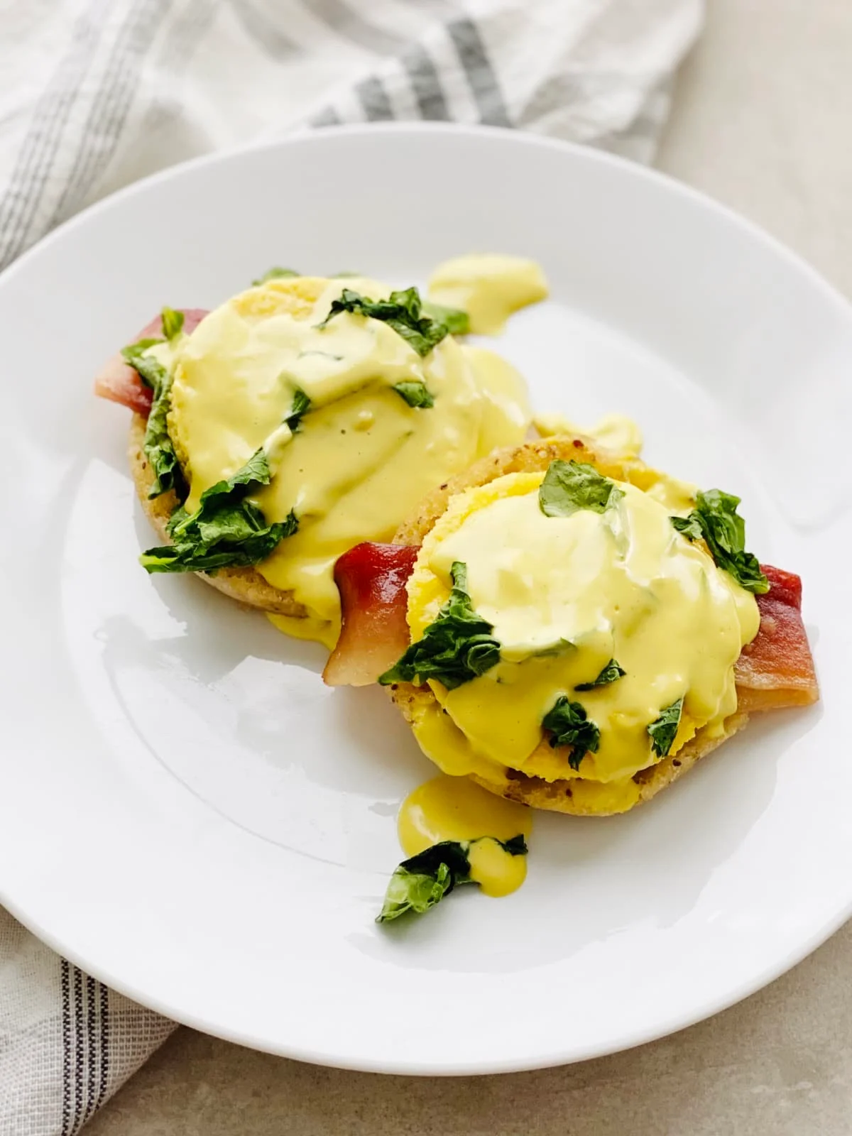 Asparagus, bacon, and potato topped with a gooey liquid yellow egg