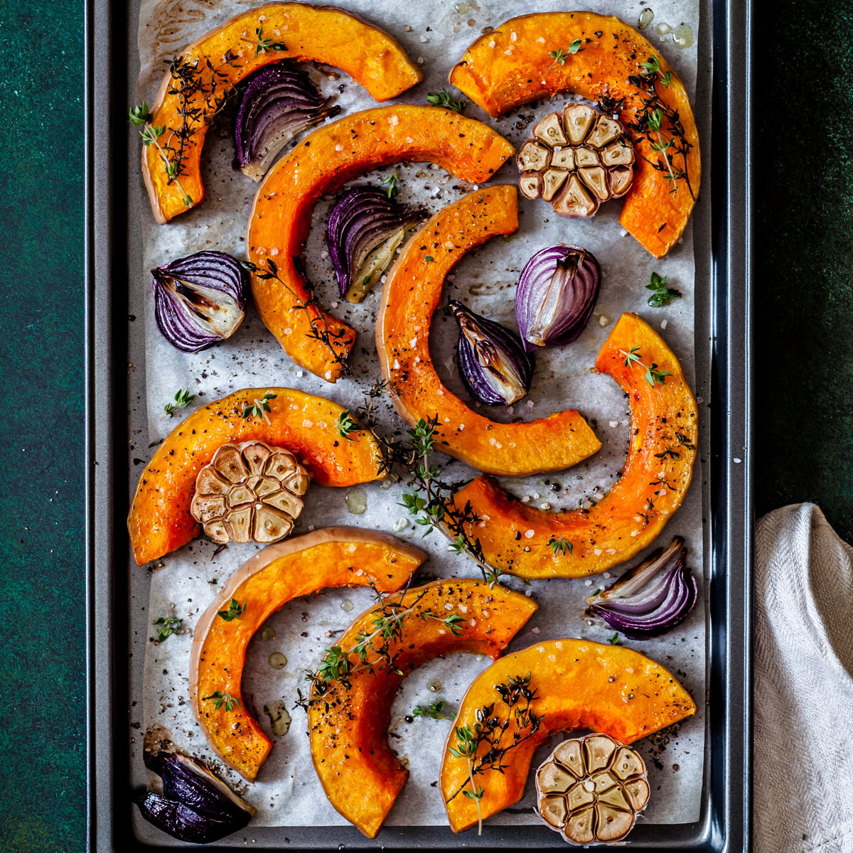 Butternut squash, onion and garlic in a sheet pan.