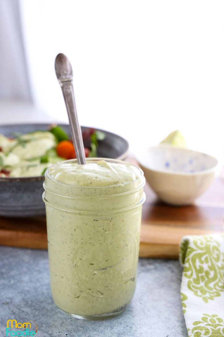 Tangy and creamy avocado sauce in a jar, perfect for falafels.