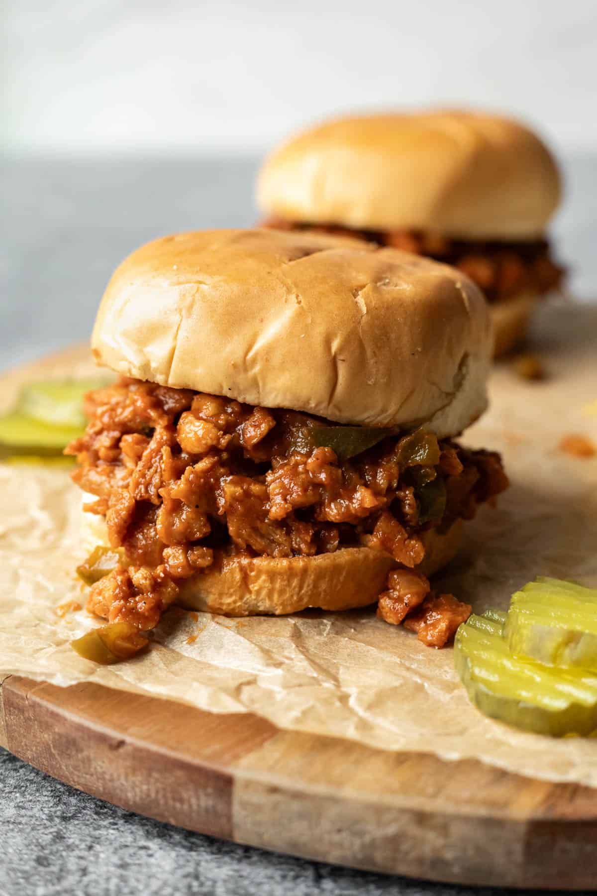 Close up of meatless sloppy joes showing the thick sauce and meaty texture of soy curl bits. 