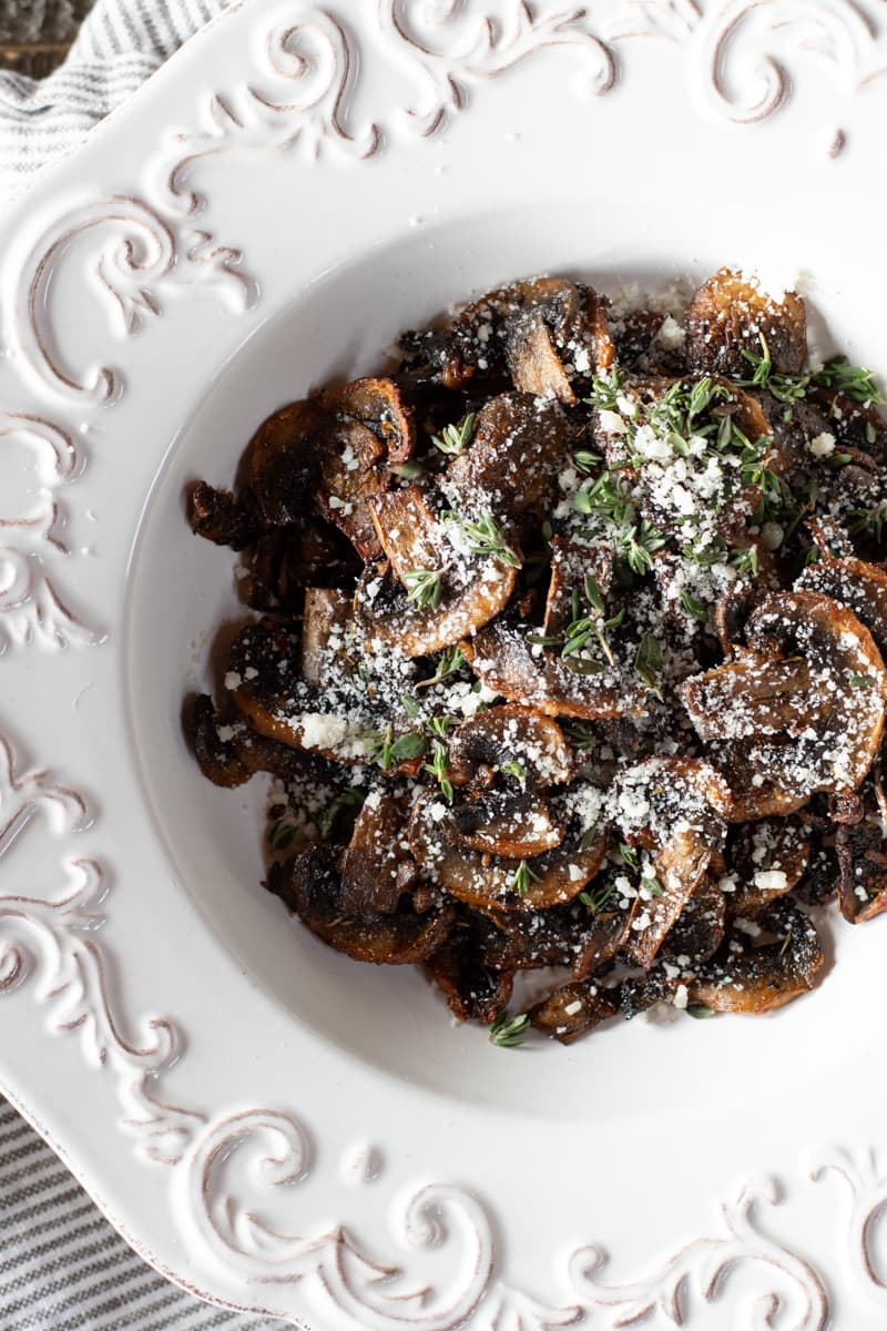 Mushroom slices in a white plate.