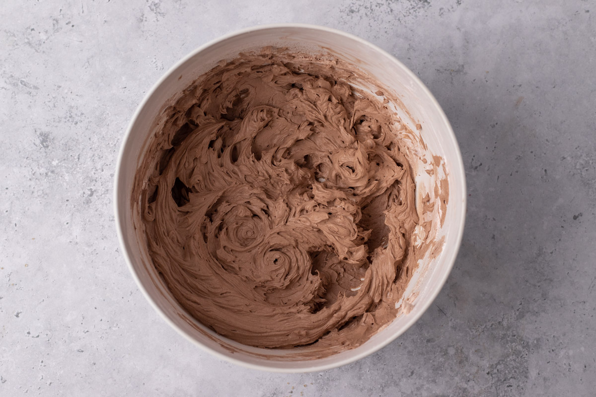White bowl with light brown fluffy cream