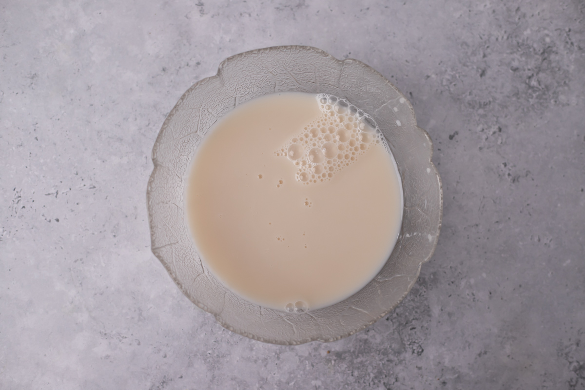 Glass bowl with milk.