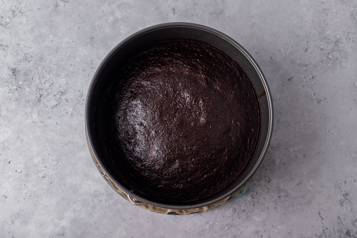 Cake pan with dark brown cake.
