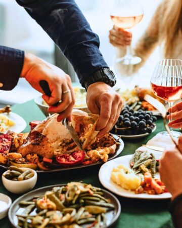 Cutting turkey during Thanksgiving.